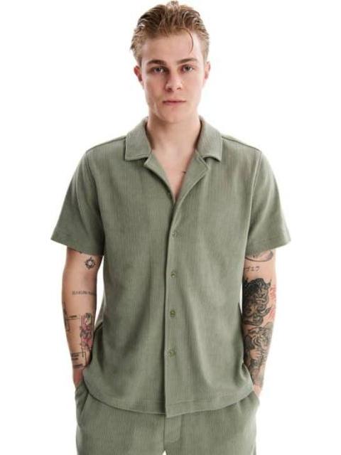 CAMISA MANGA CORTA VERDE OLIVO NEXT CO