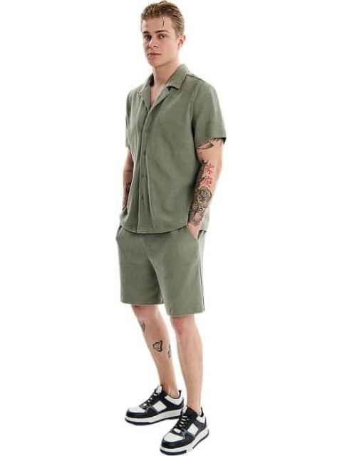 SHORT BASICO VERDE OLIVO NEXT CO - Imagen 2